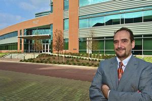 Doctor Vrinceanu standing in front of the Science and Technology Building.